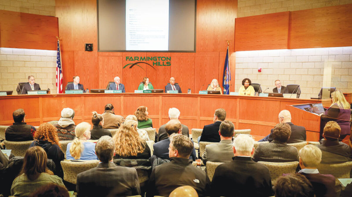  Members of the Farmington Hills City Council listen carefully Nov. 10 as developers and residents debate a proposed development for the Parker/Lundy community. More than 40 people requested that the project be denied. 