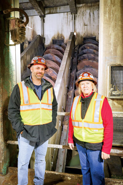 Macomb County Public Works Commissioner Candice Miller and Vince Astorino, operations manager of the Southeast Macomb Sanitary District, stand in front of the large screw pumps that will be replaced at the Bon Heur Pump Station near Harper Avenue and Frazho Street in St. Clair Shores. 