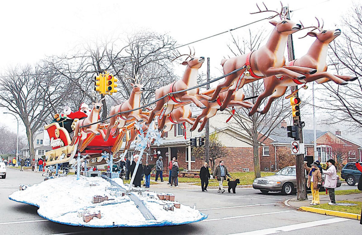  Santa Claus — the star of the Grosse Pointe Santa Claus Parade — has traveled the parade route in different vehicles and floats over the years; this photo — from circa 2007 — shows him aboard his former float. 
