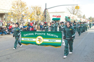  The Grosse Pointe North High School Marching Band makes its way down Kercheval Avenue in The Village in the 2012 parade.  