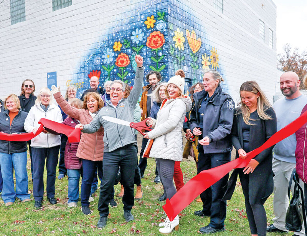 Fraser city officials, Detroit Institute of Arts staff and other guests cut the ribbon to unveil the mural called “Unity Garden" at the Senior Activity Center. 