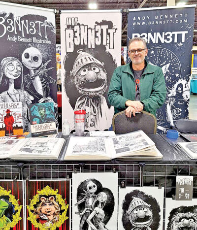  Comic artist Andy Bennett, of Columbus, Ohio, displays his work at the fall Motor City Comic Con. 