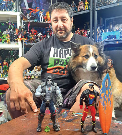  Thano Karimalis sits with his dog, Missy, and displays his favorite action figures in his massive collection. 