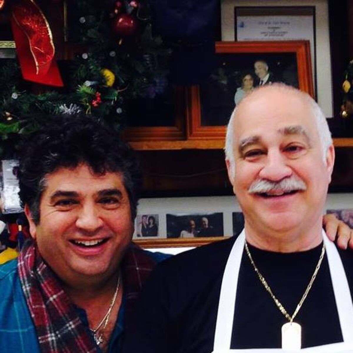  “He was a very helpful person. He had a big heart,” David Rubello, left, said of Sam Hakim, owner of the family business Emily’s Delicatessen in St. Clair Shores. “If you asked him, he’d do anything for you.” 