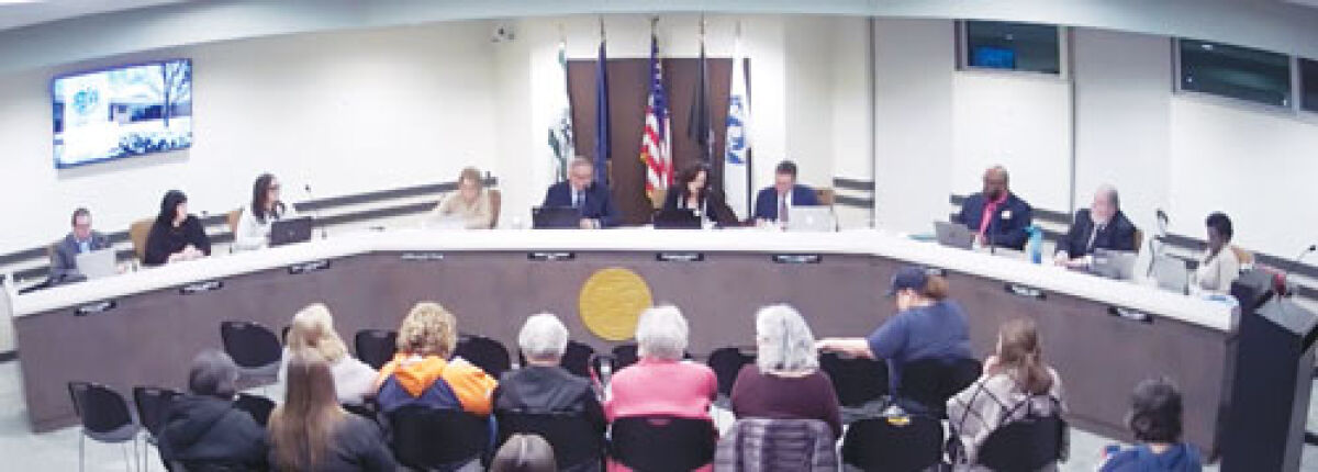  The 36th City Council of Madison Heights conducts business during its first meeting Nov. 19. New to the council are Laurie Geralds, second from left, and Mayor Corey Haines, fifth from left. Returning to the council is Toya Aaron, far right.  