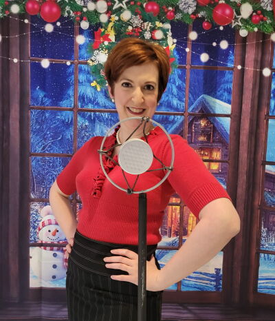  Jenna Kellie Pittman poses at a microphone on Dec. 3 as part of cast photos for Rosedale Community Players’  “An Evening of Radio Plays.” 