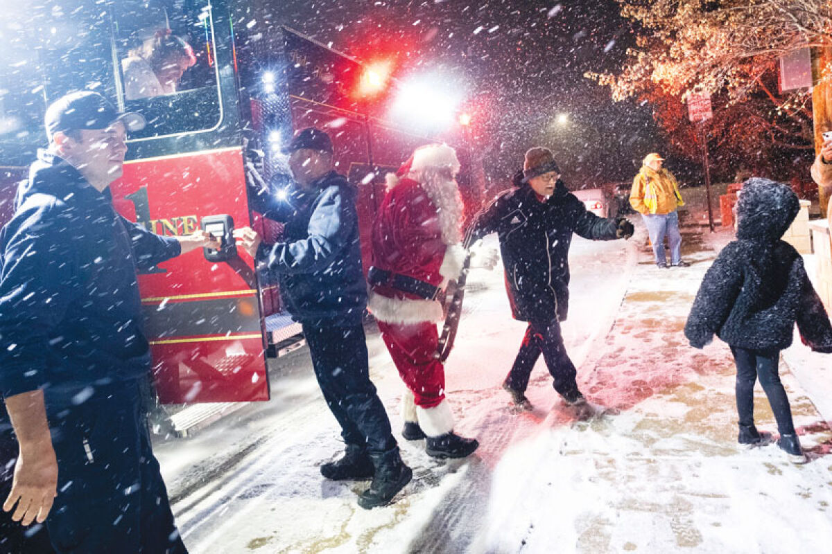  Santa Claus steps out of an Eastpointe fire truck during the city’s Christmas tree lighting ceremony Wednesday, Dec. 3. 