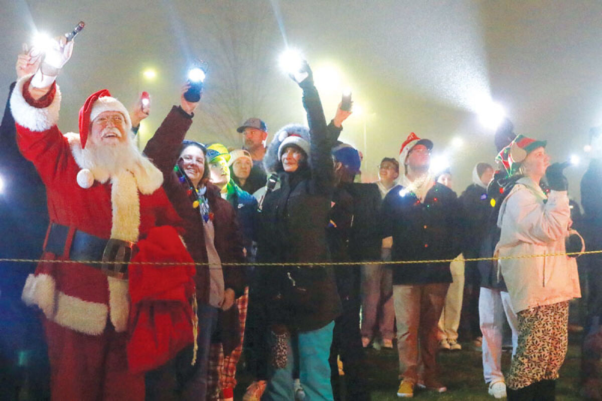  Participants in Moonbeams for Sweet Dreams on Dec. 15, 2024, shine lights from the parking lot to connect with pediatric patients at Corewell Health Children’s at William Beaumont University Hospital in Royal Oak. 