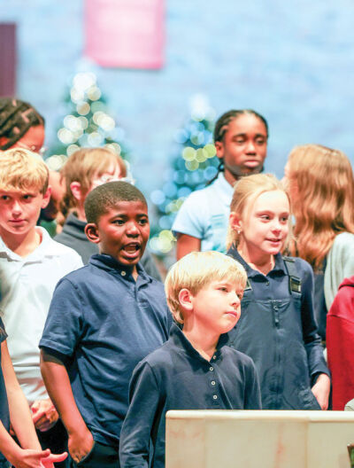 Students sing for the chamber members.