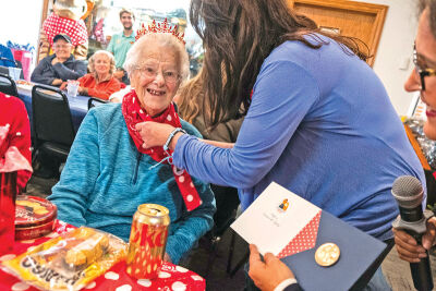  Maryellen Robbins is presented with a replica of the Congressional Gold Medal during a recognition ceremony Nov. 23 at the American Legion Devereaux Post 141 in Howell. 