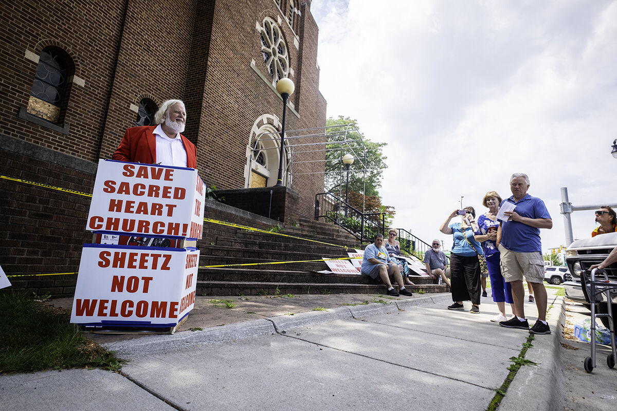  The Rev. Curtiss Ostosh speaks at a press conference Saturday, Aug. 16,  at the former Catholic Community of  Sacred Heart in Roseville. 