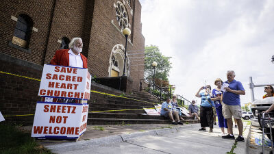  The Rev. Curtiss Ostosh speaks at a press conference Saturday, Aug. 16,  at the former Catholic Community of  Sacred Heart in Roseville. 
