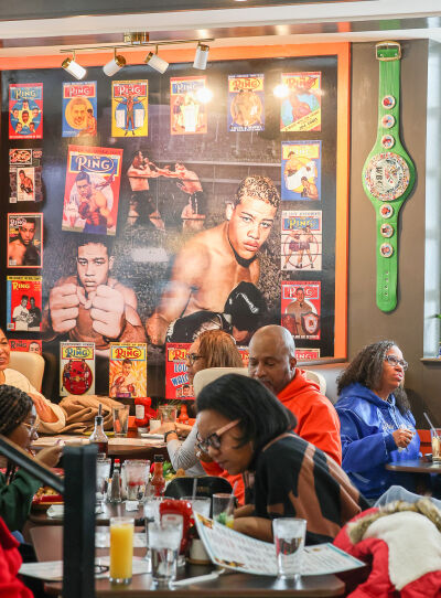  Photographs and memorabilia decorate the walls of the newly opened Southfield Joe Louis Southern Kitchen Dec. 9. 