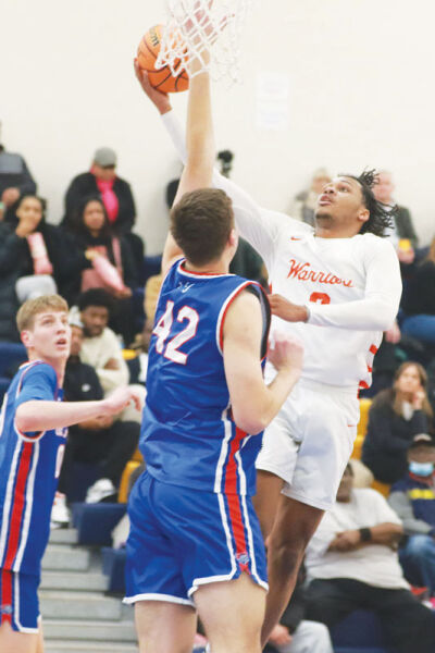  Greg Grays finishes at the net for Brother Rice against St. Francis de Sales. Brother Rice won 58-55.  