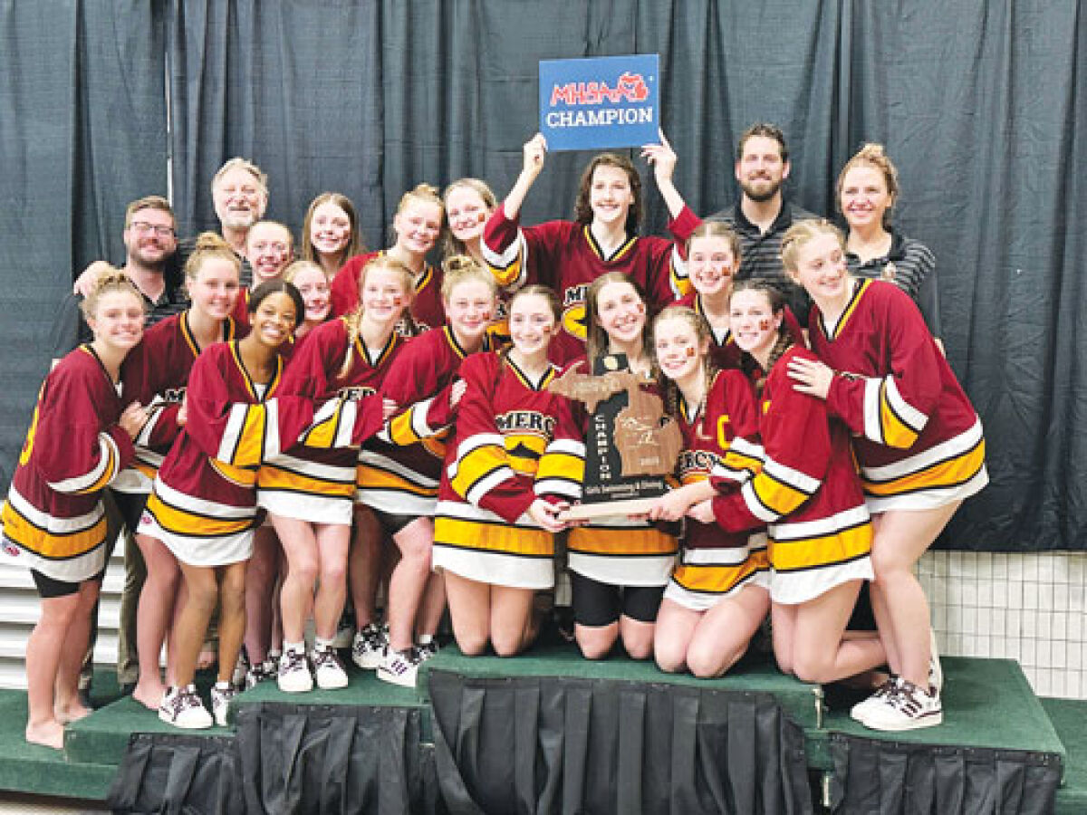  The Farmington Hills Mercy girls swim team poses with the MHSAA Division 2 trophy at Eastern Michigan University Nov 22. 