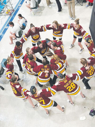  Mercy girls huddle up after officially winning the 2025 state championship. 