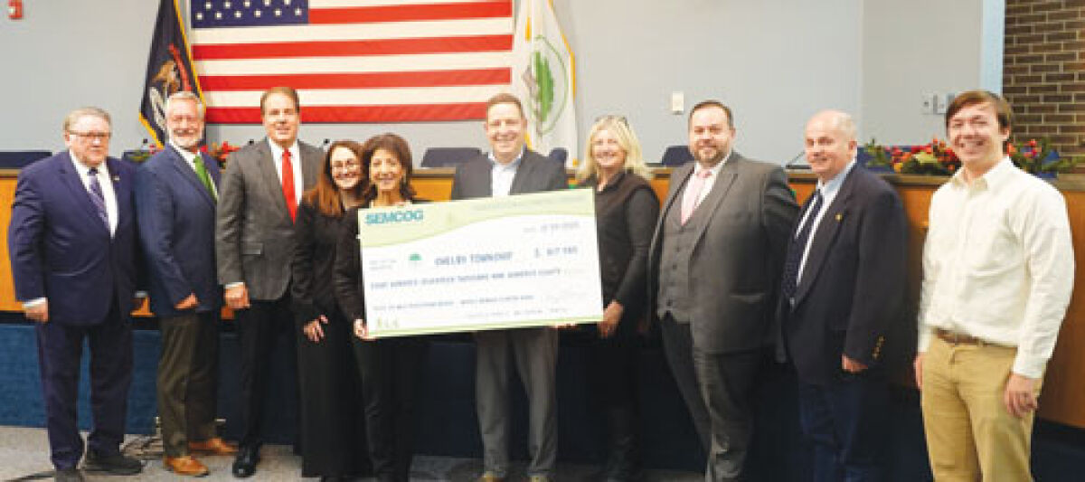  The Southeast Michigan Council of Governments awarded $817,980 in Transportation Alternatives Program funding to Shelby Township for a pedestrian bridge over the Middle Branch of the Clinton River. From left, Shelby Township Clerk Stanley T. Grot; Treasurer James Carabelli; Supervisor Rick Stathakis; Trustee Lucia Di Cicco; Trustee Lisa Casali; SEMCOG Planning Director Kevin Vettraino; Lisa Brown, community director for U.S. Rep. John James; Kyle Johnson, regional manager, Macomb and Thumb, for U.S. Sen. Elissa Slotkin; Trustee John Vermeulen; and Alec Hughes, regional coordinator for U.S. Sen. Gary Peters. 