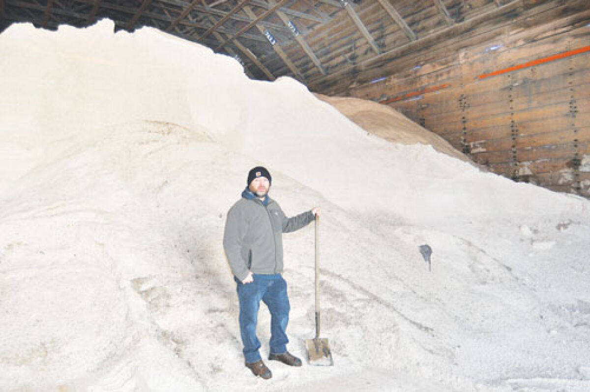  Department of Public Works Deputy Director Michael Olson stands in front of nearly 20 feet of salt at the city of Ferndale’s salt barn on Cambourne Street. 