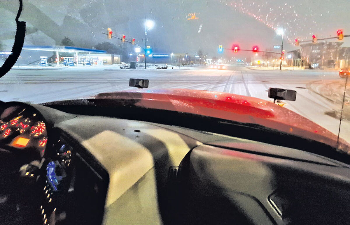  A Novi salt and plow truck heads west on Grand River Avenue toward Novi Road during the snowstorm Dec. 9. 