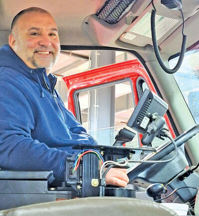  John Talbot sits in the salt and plow truck that he uses to help clear the streets of Novi during a snow emergency. 