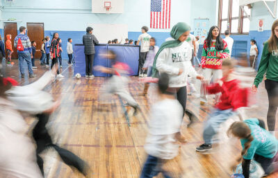 Novi High School student council members play games with students.