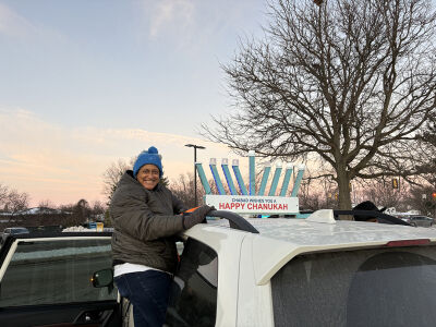  Southfield resident Pea Gee poses for a photograph at the parade setup for the Southfield Chanukah parade and menorah lighting on Dec. 16. 