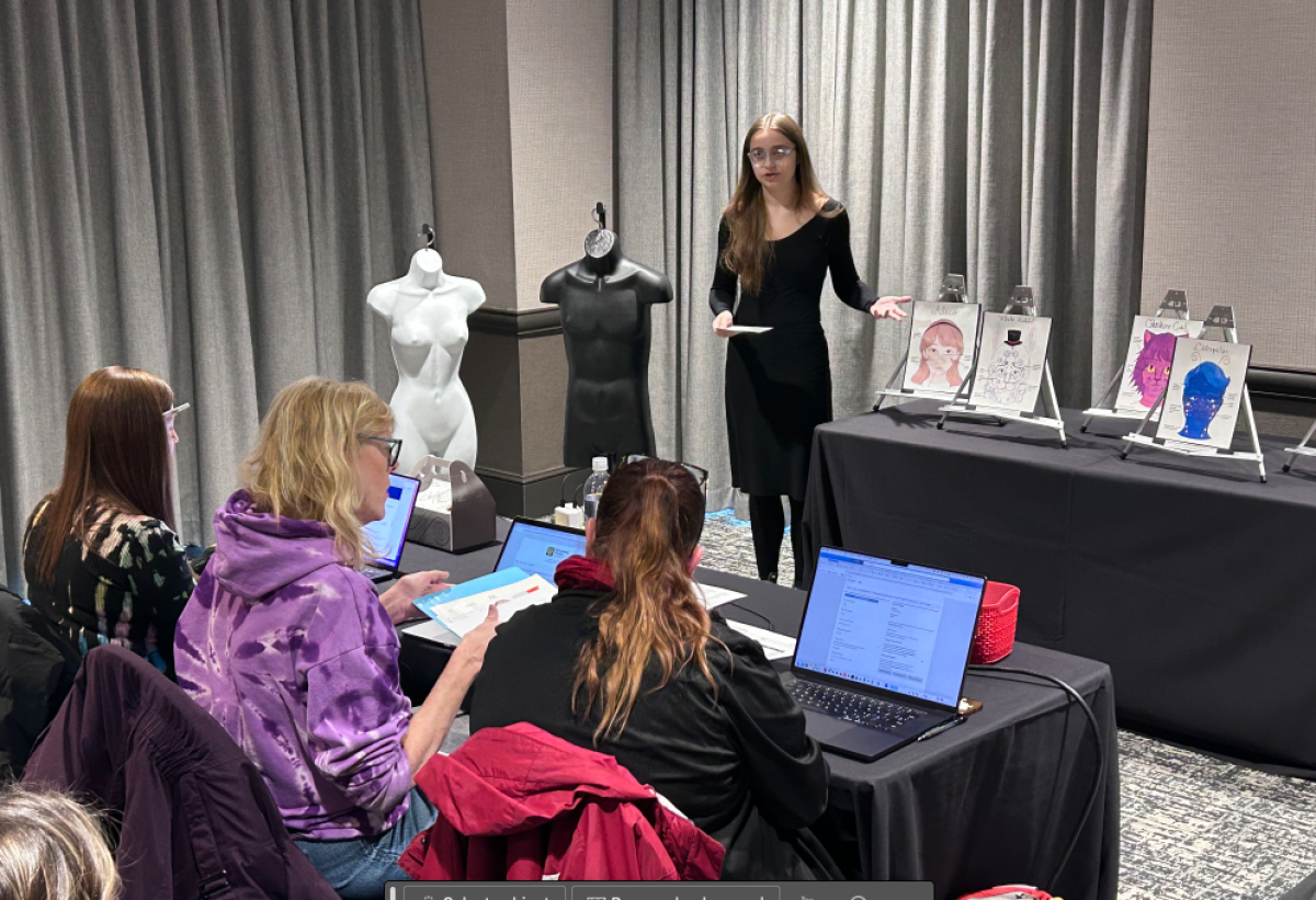  Warren Consolidated Schools Performing Arts student Jade Wold presents her makeup design to three judges during the Thespian Competition portion of the Michigan Thespian Festival held Dec. 12. 