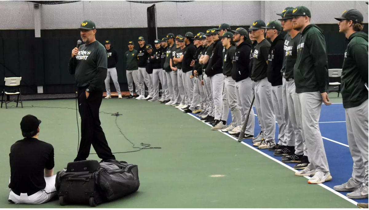 Wayne State University baseball players and coaches speak to participants during a Born in Detroit baseball camp. 