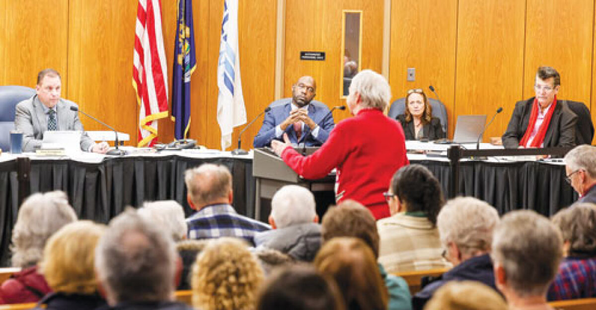  A member of the public speaks to the Clinton Township Board of Trustees ahead of a vote to merge the senior center and Recreation Department at the board’s Dec. 22 meeting. 