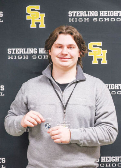  One side of the challenge coin reads “Sterling Heights Police,” and the flip side reads “School resource officer more than officers, mentors and allies” with the  Utica Community Schools and Warren Consolidated Schools logos. 