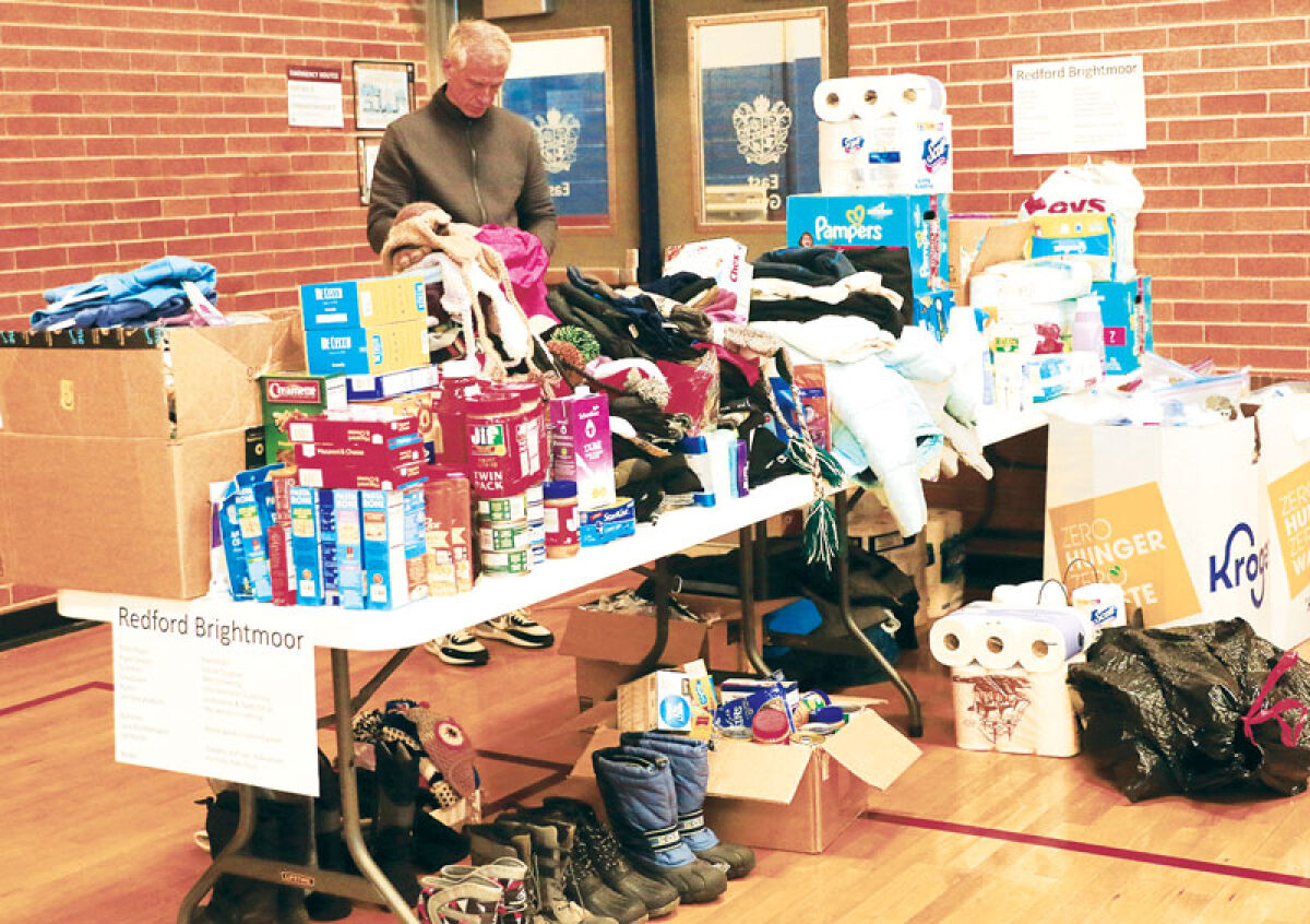  Clawson High School will be hosting its annual day of service event with the Berkley and Royal Oak school districts and cities in honor of Martin Luther King Jr. on Jan. 19. A volunteer sorts through donations for those in need at last year’s MLK day of service event at Berkley High School. 