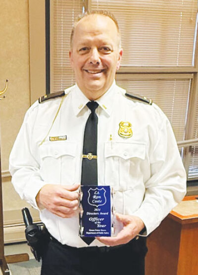  Grosse Pointe Shores Public Safety Lt. Ron Coste holds the director’s award he received on March 18, 2025, for his work for the department in 2024. 