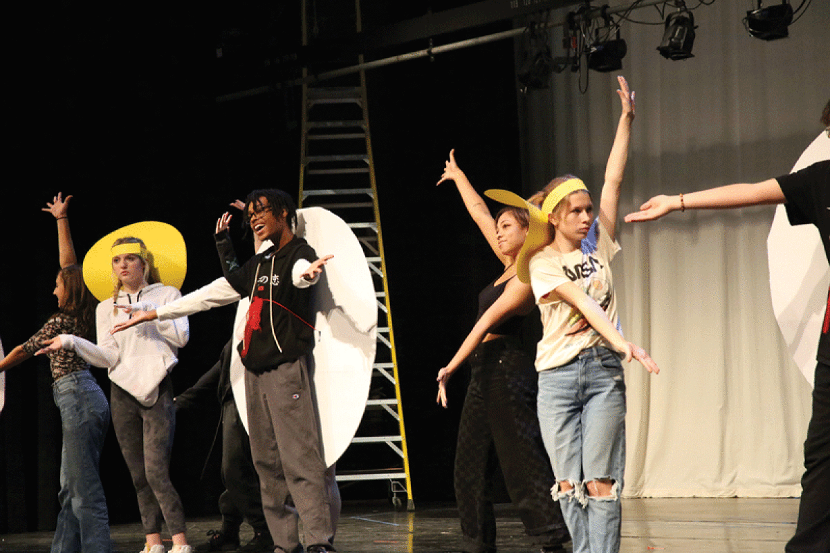  Performers for Chippewa Valley High School’s production of “Beauty and the Beast” practice choreography for “Be Our Guest” on Oct. 13. Mock costumes are used to simulate the spacing allowed by costumes used in the actual performances.  