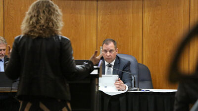  Clinton Township Supervisor Paul Gieleghem listens to Judge Carrie Lynn Fuca of the 41B District Court talk about kratom at the Jan. 12 Clinton Township Board of Trustees meeting. 